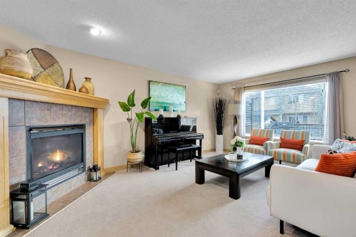 270 Everstone Drive Sw, Calgary, AB - Indoor Photo Showing Living Room With Fireplace