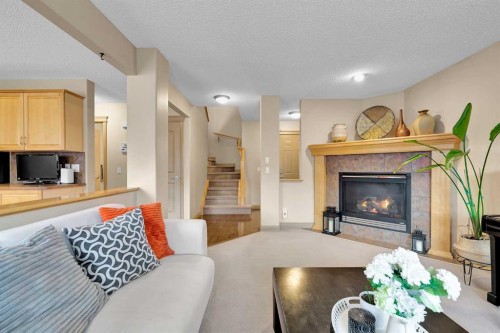 270 Everstone Drive Sw, Calgary, AB - Indoor Photo Showing Living Room With Fireplace