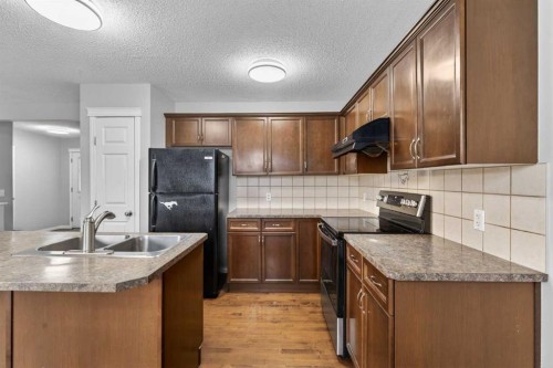 23 Taralake Lane Ne, Calgary, AB - Indoor Photo Showing Kitchen With Double Sink