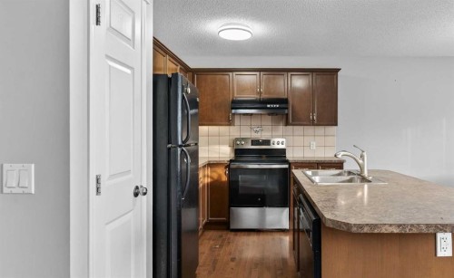 23 Taralake Lane Ne, Calgary, AB - Indoor Photo Showing Kitchen With Double Sink