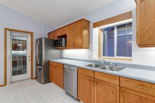 20 Willowbrook Gate Nw, Airdrie, AB - Indoor Photo Showing Kitchen With Double Sink