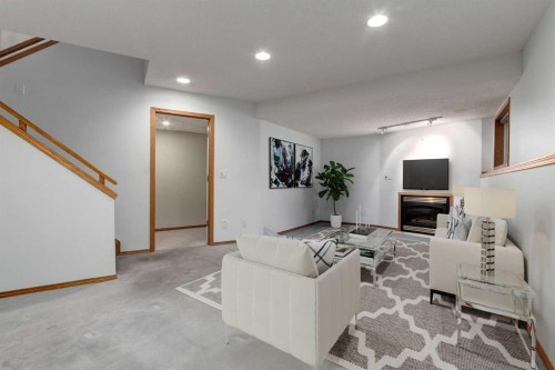 20 Willowbrook Gate Nw, Airdrie, AB - Indoor With Fireplace