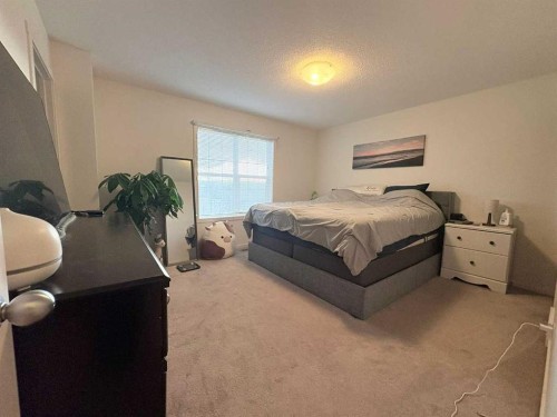 36 Evansborough Common Nw, Calgary, AB - Indoor Photo Showing Bedroom