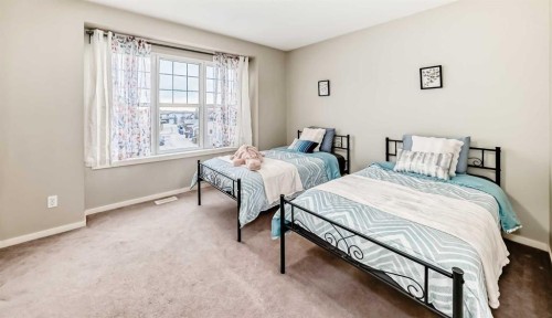 822 Panatella Boulevard Nw, Calgary, AB - Indoor Photo Showing Bedroom
