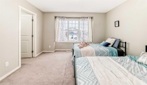 822 Panatella Boulevard Nw, Calgary, AB - Indoor Photo Showing Bedroom