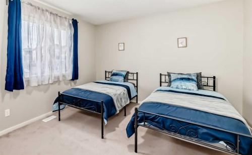 822 Panatella Boulevard Nw, Calgary, AB - Indoor Photo Showing Bedroom