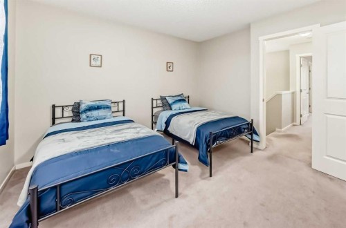 822 Panatella Boulevard Nw, Calgary, AB - Indoor Photo Showing Bedroom