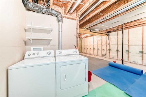 822 Panatella Boulevard Nw, Calgary, AB - Indoor Photo Showing Laundry Room