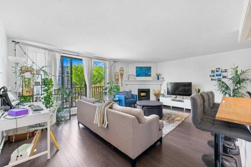 B-518 18 Avenue Sw, Calgary, AB - Indoor Photo Showing Living Room With Fireplace