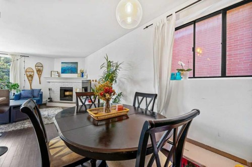 B-518 18 Avenue Sw, Calgary, AB - Indoor Photo Showing Dining Room With Fireplace