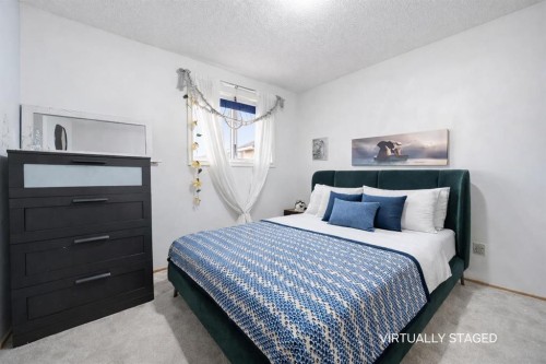 24 Laguna Close Ne, Calgary, AB - Indoor Photo Showing Bedroom