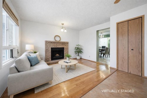 24 Laguna Close Ne, Calgary, AB - Indoor Photo Showing Living Room With Fireplace