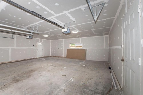 140 Whitworth Way, Calgary, AB - Indoor Photo Showing Garage