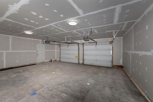 140 Whitworth Way, Calgary, AB - Indoor Photo Showing Garage