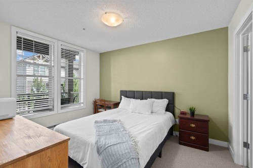 304-201 Sunset Drive, Cochrane, AB - Indoor Photo Showing Bedroom