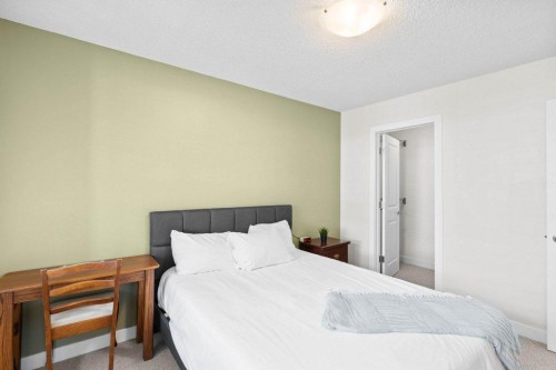 304-201 Sunset Drive, Cochrane, AB - Indoor Photo Showing Bedroom