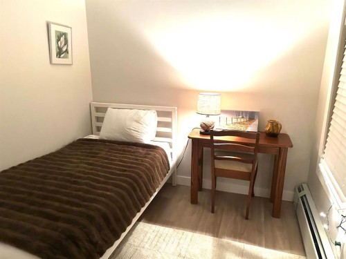 304-201 Sunset Drive, Cochrane, AB - Indoor Photo Showing Bedroom