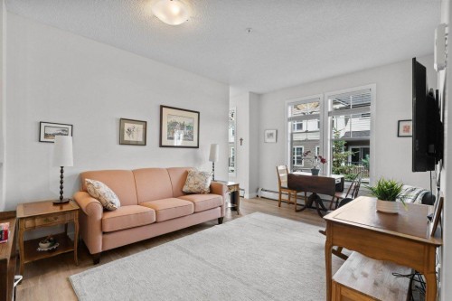 304-201 Sunset Drive, Cochrane, AB - Indoor Photo Showing Living Room