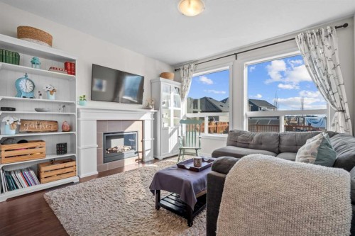 1112 Williamstown Boulevard Nw, Airdrie, AB - Indoor Photo Showing Living Room With Fireplace