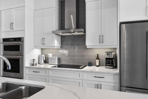 206 Crestridge Common Sw, Calgary, AB - Indoor Photo Showing Kitchen With Stainless Steel Kitchen With Double Sink With Upgraded Kitchen