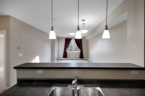 1224-2370 Bayside Road Sw, Airdrie, AB - Indoor Photo Showing Kitchen With Double Sink