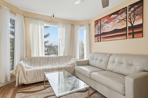 80 Taradale Drive South, Calgary, AB - Indoor Photo Showing Living Room