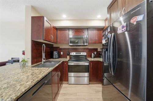 80 Taradale Drive South, Calgary, AB - Indoor Photo Showing Kitchen With Double Sink