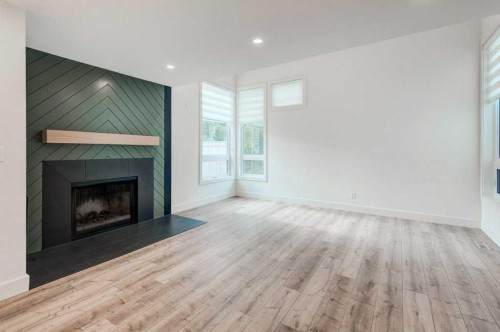 17 Millrise Lane Sw, Calgary, AB - Indoor Photo Showing Living Room With Fireplace