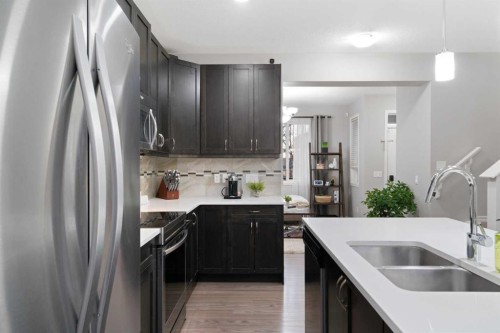 1529 Legacy Circle Se, Calgary, AB - Indoor Photo Showing Kitchen With Stainless Steel Kitchen With Double Sink With Upgraded Kitchen