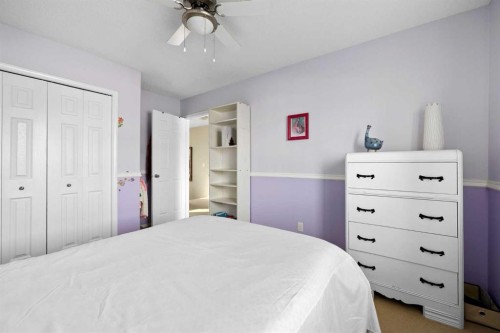 73 Sunset Heights, Cochrane, AB - Indoor Photo Showing Bedroom