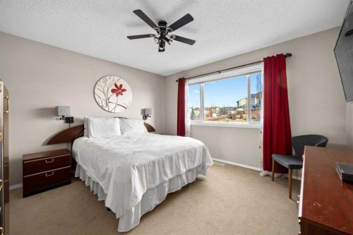 73 Sunset Heights, Cochrane, AB - Indoor Photo Showing Bedroom