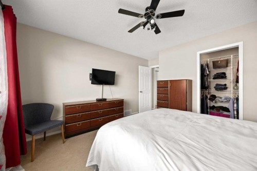73 Sunset Heights, Cochrane, AB - Indoor Photo Showing Bedroom