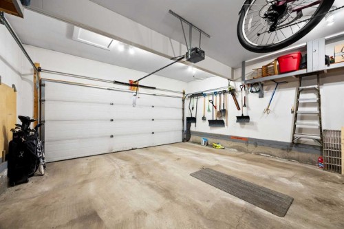 73 Sunset Heights, Cochrane, AB - Indoor Photo Showing Garage
