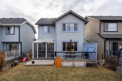 73 Sunset Heights, Cochrane, AB - Outdoor With Deck Patio Veranda With Exterior