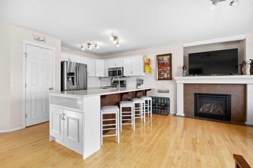 73 Sunset Heights, Cochrane, AB - Indoor With Fireplace