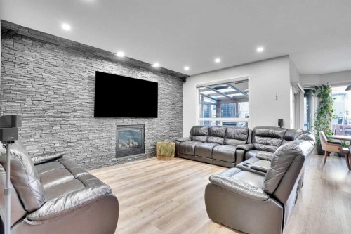 119 Panton Landing Nw, Calgary, AB - Indoor Photo Showing Living Room With Fireplace