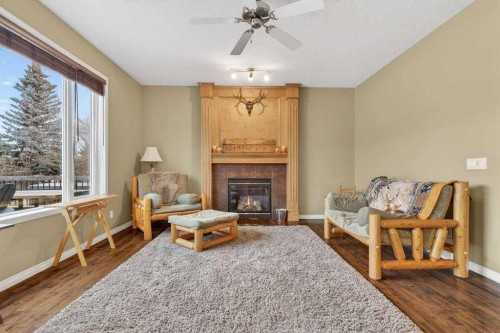 55 Sheep River Cove, Okotoks, AB - Indoor Photo Showing Living Room With Fireplace