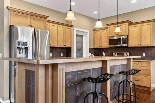 55 Sheep River Cove, Okotoks, AB - Indoor Photo Showing Kitchen With Upgraded Kitchen