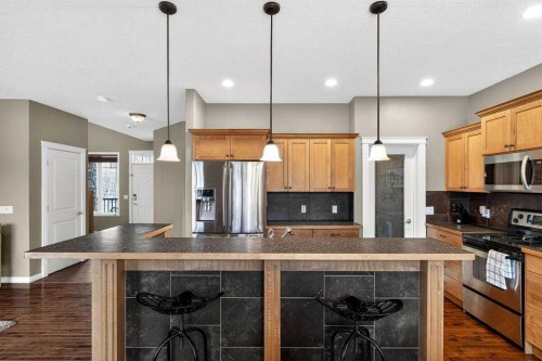 55 Sheep River Cove, Okotoks, AB - Indoor Photo Showing Kitchen With Upgraded Kitchen