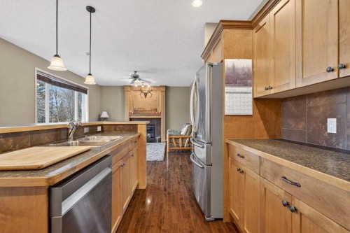 55 Sheep River Cove, Okotoks, AB - Indoor Photo Showing Kitchen With Double Sink