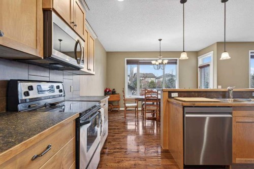 55 Sheep River Cove, Okotoks, AB - Indoor Photo Showing Kitchen With Double Sink