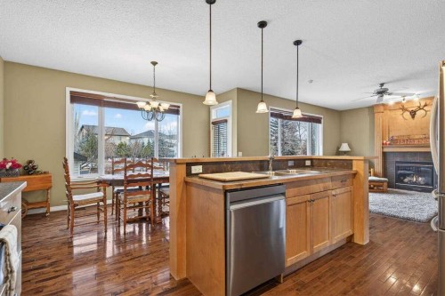 55 Sheep River Cove, Okotoks, AB - Indoor With Fireplace