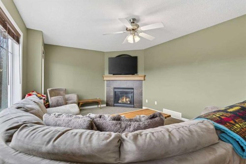 55 Sheep River Cove, Okotoks, AB - Indoor Photo Showing Living Room With Fireplace