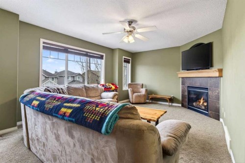 55 Sheep River Cove, Okotoks, AB - Indoor With Fireplace