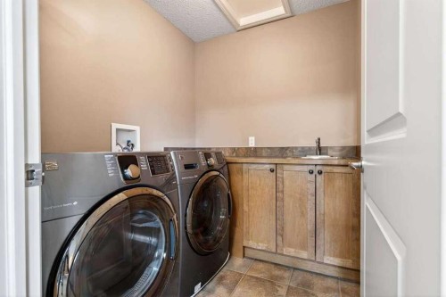 55 Sheep River Cove, Okotoks, AB - Indoor Photo Showing Laundry Room