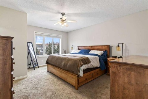 55 Sheep River Cove, Okotoks, AB - Indoor Photo Showing Bedroom