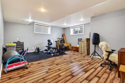 55 Sheep River Cove, Okotoks, AB - Indoor Photo Showing Gym Room