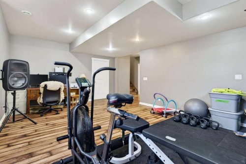 55 Sheep River Cove, Okotoks, AB - Indoor Photo Showing Gym Room