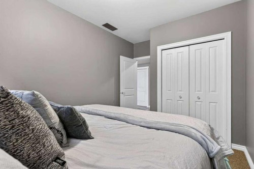 55 Sheep River Cove, Okotoks, AB - Indoor Photo Showing Bedroom