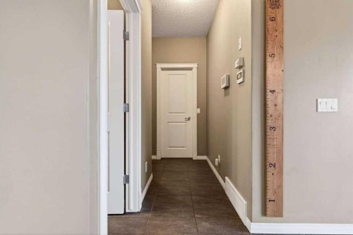 55 Sheep River Cove, Okotoks, AB - Indoor Photo Showing Other Room